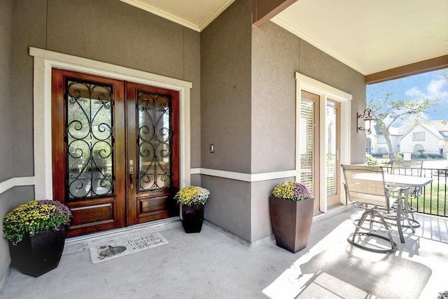 15 Bees Creek Ct, Missouri City, TX 77459 - doorway to property featuring french doors, a porch, and stucco siding