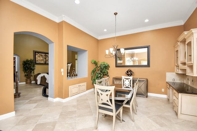 dining area with crown molding, light tile patterned flooring, and an inviting chandelier