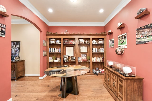 office with ornamental molding and light wood-type flooring