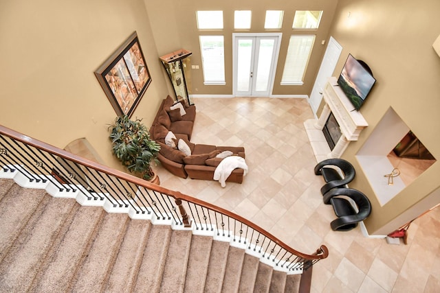 15 Bees Creek Ct, Missouri City, TX 77459 - stairs featuring french doors, tile patterned floors, and baseboards