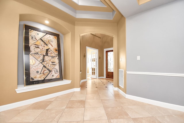 foyer featuring light tile patterned floors