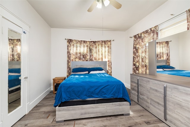 bedroom featuring ceiling fan and hardwood / wood-style floors