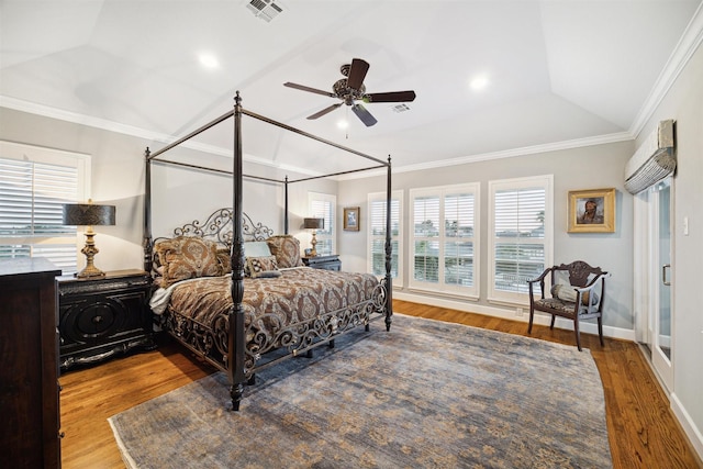 bedroom featuring crown molding, ceiling fan, a raised ceiling, and hardwood / wood-style floors