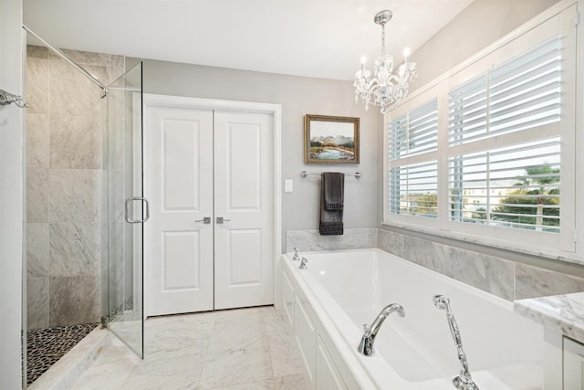 bathroom featuring a notable chandelier and plus walk in shower