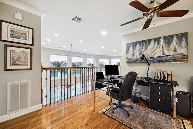 office with hardwood / wood-style flooring and ornamental molding