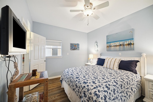 bedroom with dark hardwood / wood-style floors and ceiling fan