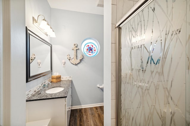 bathroom with vanity, hardwood / wood-style floors, and walk in shower