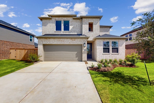 view of front facade featuring a garage and a front yard