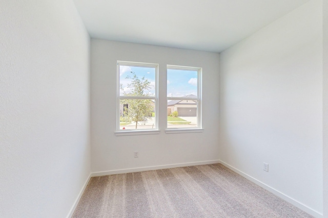 spare room with carpet floors