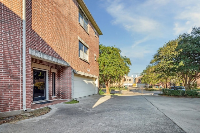 view of side of home with a garage