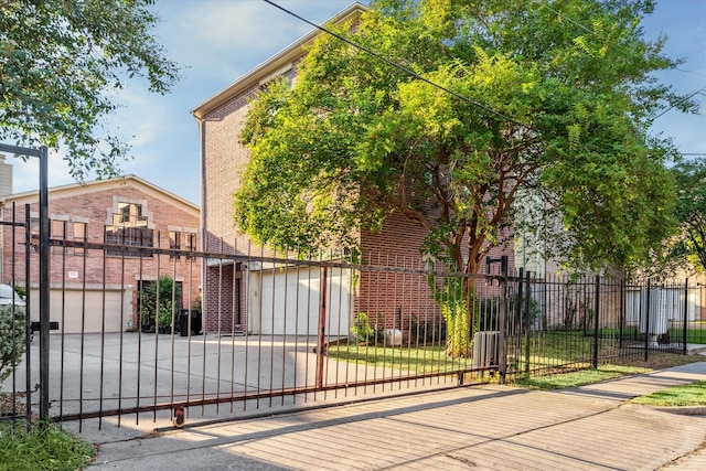 view of gate featuring a garage