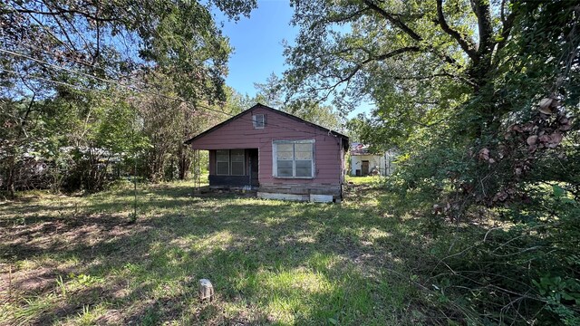 107 Church St, Willis, TX 77378 - exterior space with a yard