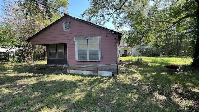 view of home's exterior featuring a yard