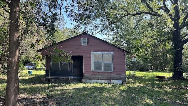 view of home's exterior featuring a lawn