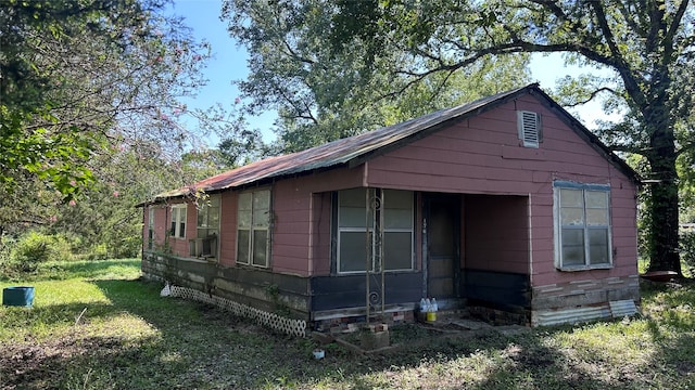 view of home's exterior with a lawn