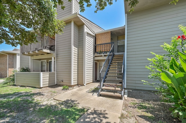 doorway to property with a balcony