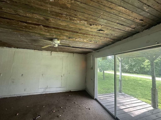 interior space with ceiling fan