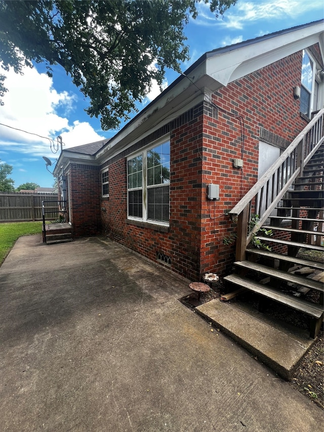 view of property exterior featuring a patio