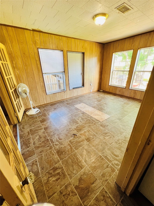 interior space featuring wood walls