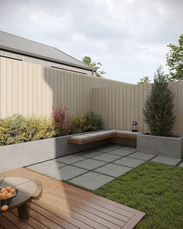 view of patio featuring a deck and a jacuzzi