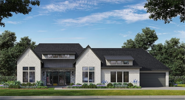 view of front of house featuring a front lawn and a garage