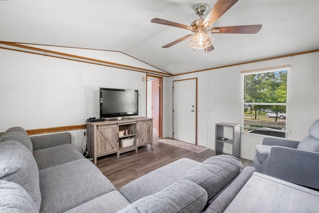 living room with ceiling fan, wood-type flooring, and vaulted ceiling