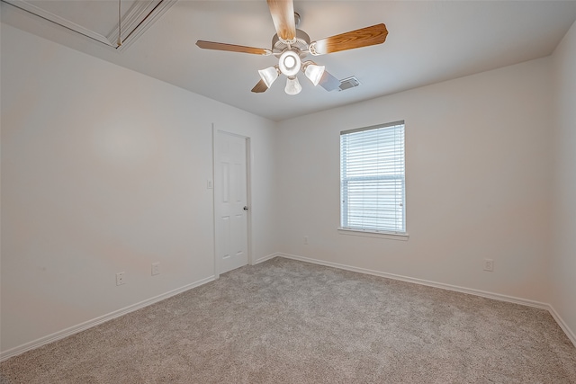 carpeted empty room featuring ceiling fan