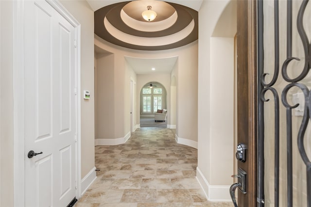 entryway with a raised ceiling