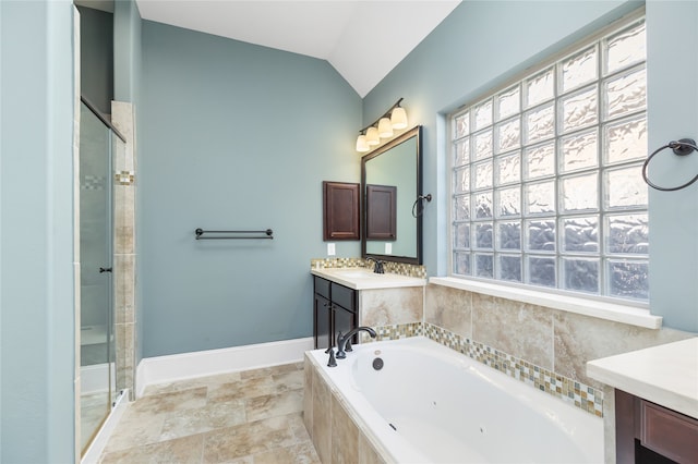 bathroom featuring vanity, plus walk in shower, and vaulted ceiling