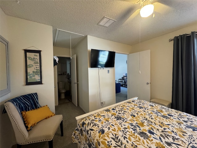 carpeted bedroom with ceiling fan, a textured ceiling, and connected bathroom