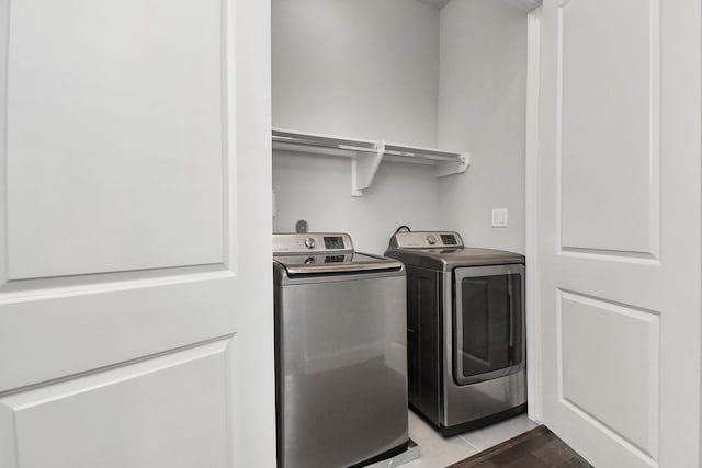 washroom with independent washer and dryer