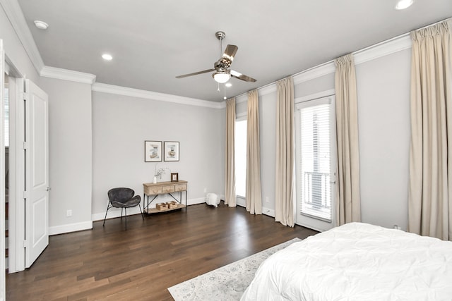 bedroom with multiple windows, dark hardwood / wood-style flooring, ornamental molding, and ceiling fan