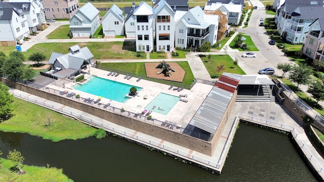 birds eye view of property with a water view