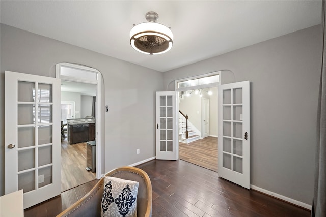 interior space featuring french doors and dark hardwood / wood-style floors