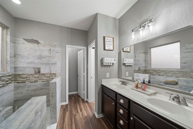 bathroom featuring walk in shower, vanity, and hardwood / wood-style flooring