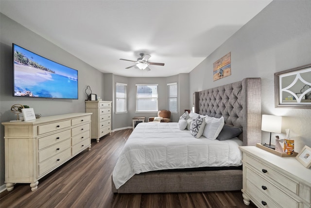 bedroom with ceiling fan and dark hardwood / wood-style floors