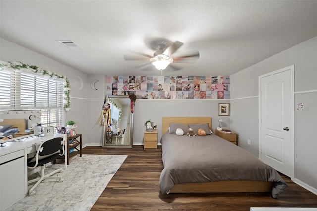 bedroom featuring ceiling fan and dark hardwood / wood-style flooring