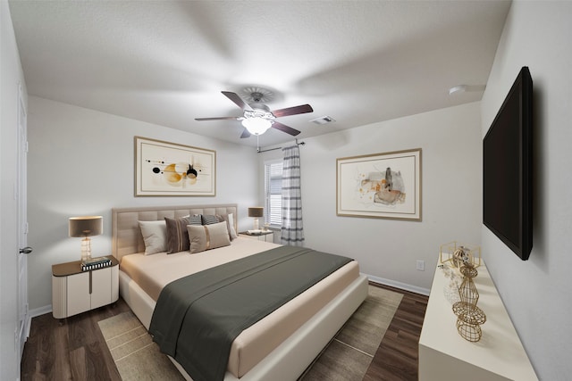 bedroom featuring ceiling fan and dark hardwood / wood-style floors