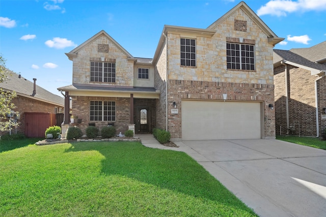 view of front of home with a front yard and a garage