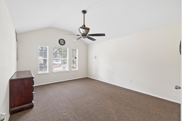 carpeted spare room with lofted ceiling and ceiling fan