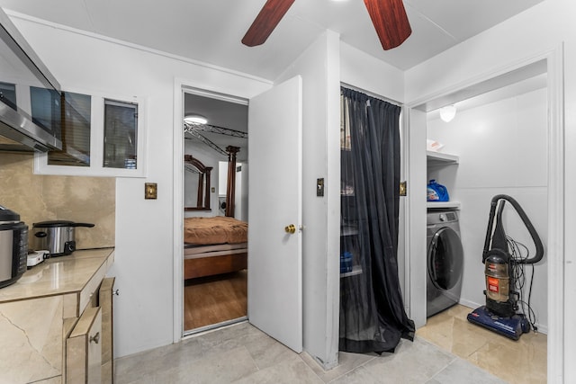 laundry area featuring ceiling fan, washer / clothes dryer, and light tile patterned floors