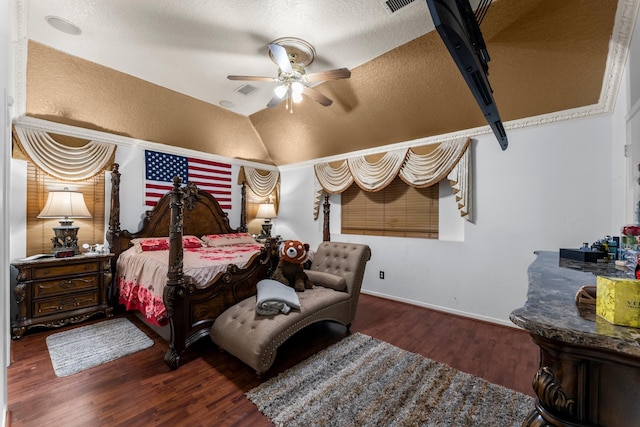 bedroom with vaulted ceiling, a ceiling fan, wood finished floors, a textured ceiling, and baseboards