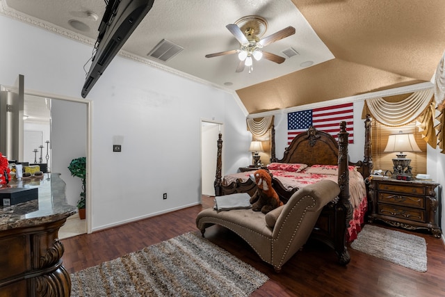 bedroom featuring ceiling fan, a textured ceiling, lofted ceiling, and dark hardwood / wood-style floors