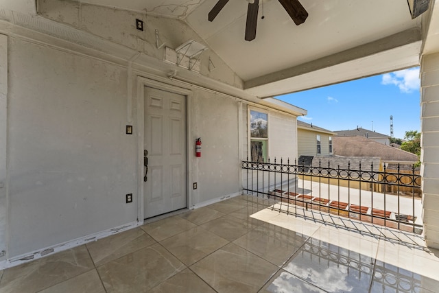 view of patio / terrace with a balcony and ceiling fan