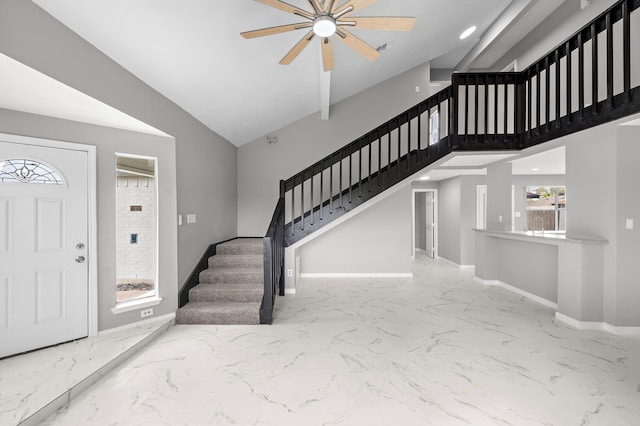 entryway featuring high vaulted ceiling and ceiling fan