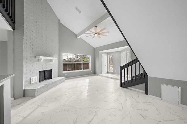 unfurnished living room with high vaulted ceiling, ceiling fan, and a fireplace