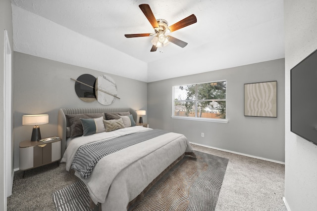 bedroom featuring ceiling fan, lofted ceiling, and dark carpet