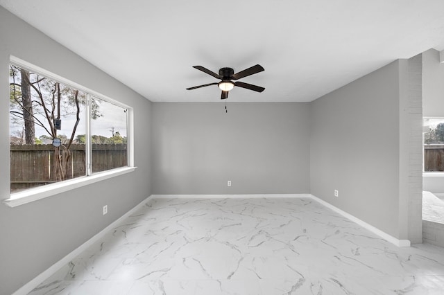 spare room featuring ceiling fan