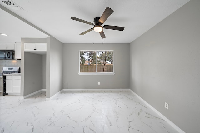 interior space featuring ceiling fan