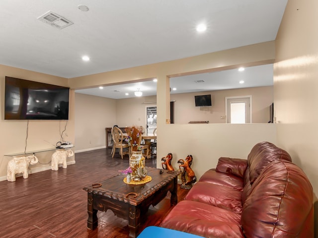 living room featuring dark hardwood / wood-style floors